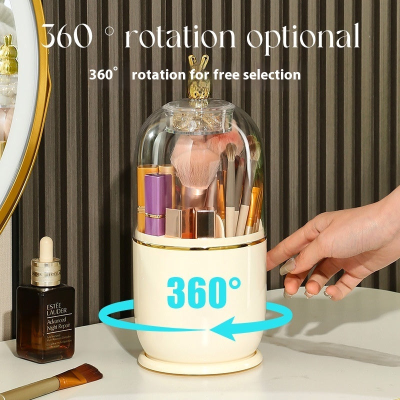 A white make up brush holder that can rotate 360 degrees and good for desk use. It's got a transparent casing and a golden bunny on top to make it look luxurious.
