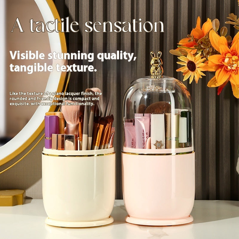2 Make up brush holder with transparent casing and a golden bunny on top. It;s filled with make up brushes inside and make up tools